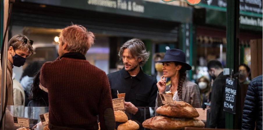 group of people in a circle enjoying some food