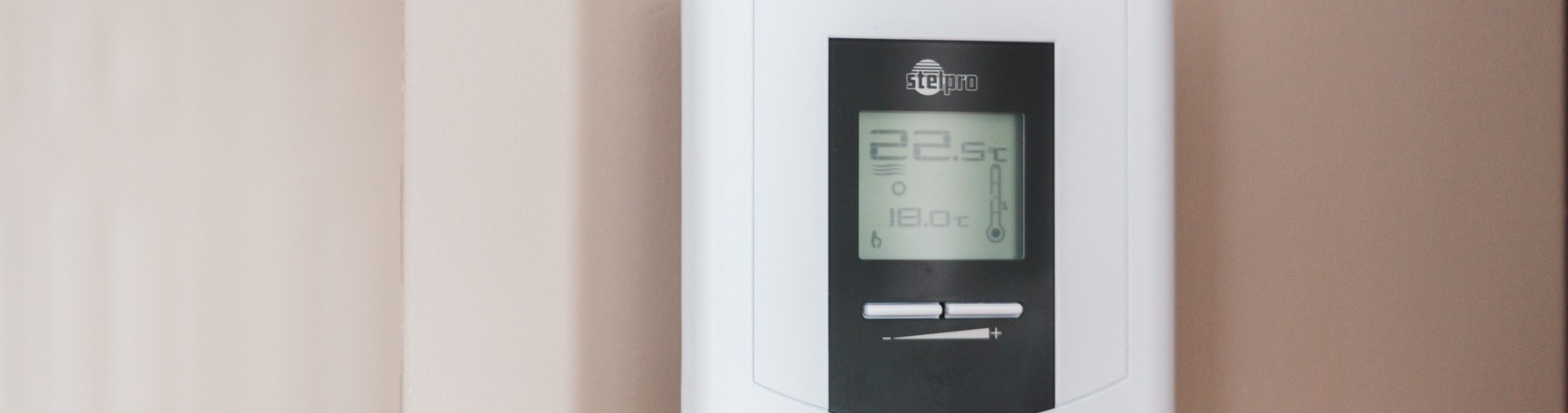 A thermostat on a wall