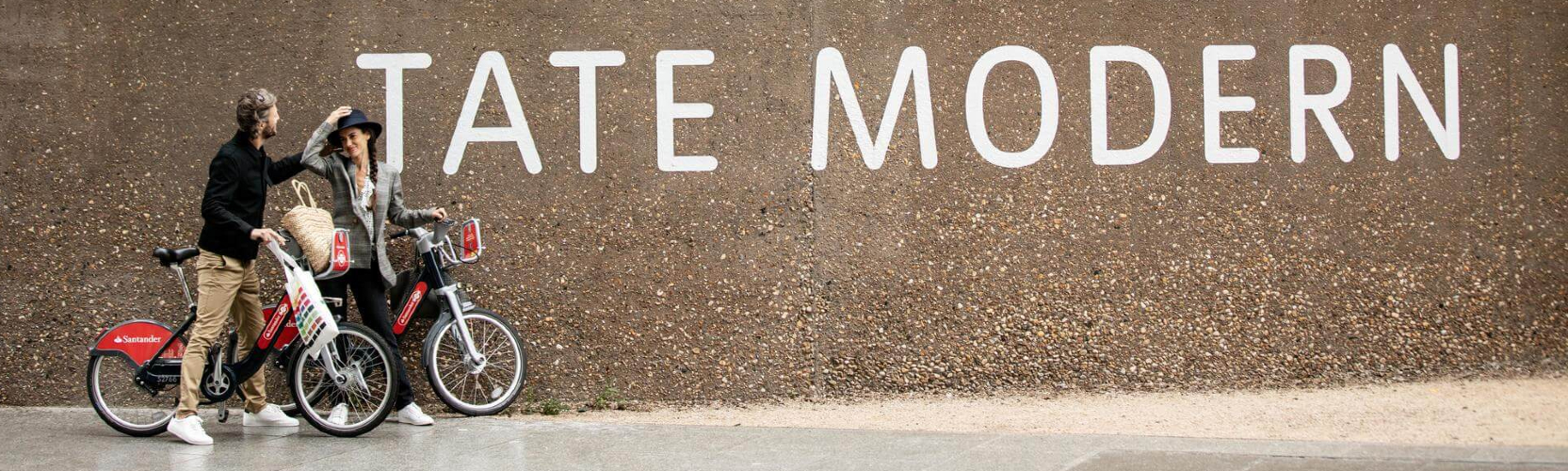 Two people outside the Tate Modern near Elephant Park