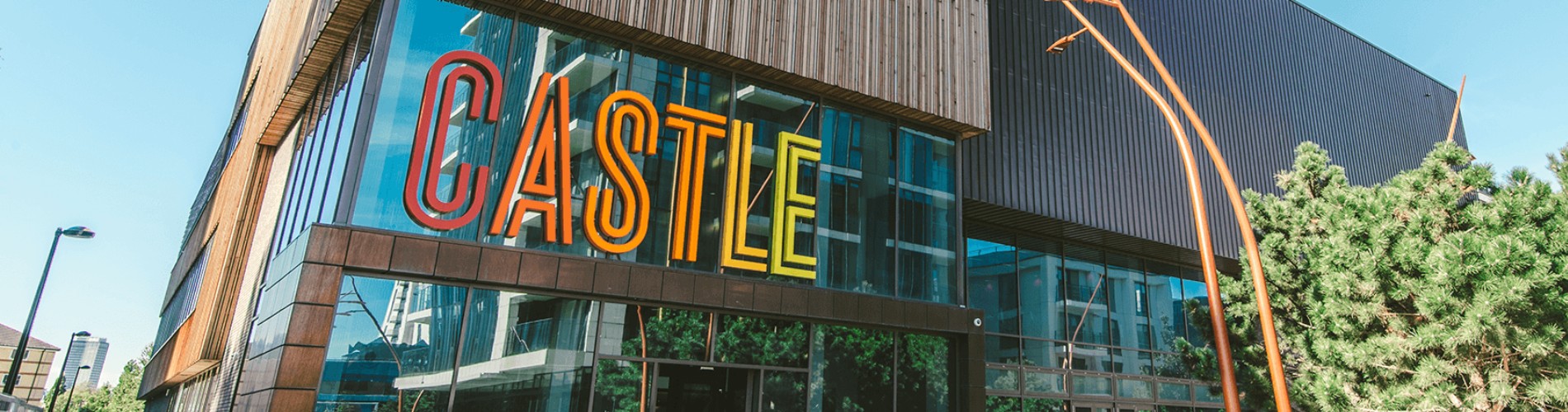 the castle centre exterior colourful signage on outside of store. Colourful exterior sign in red, orange and yellow.